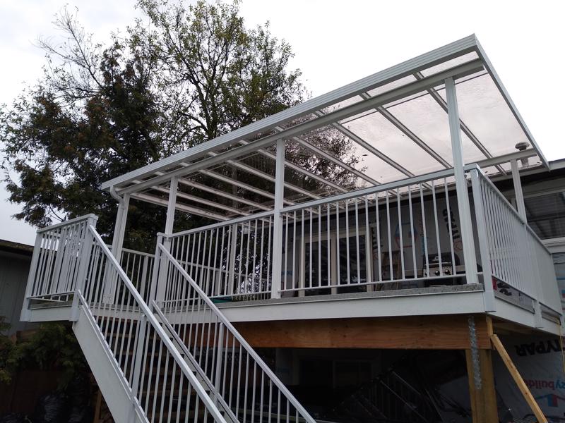 White aluminum railings on deck and staircase.