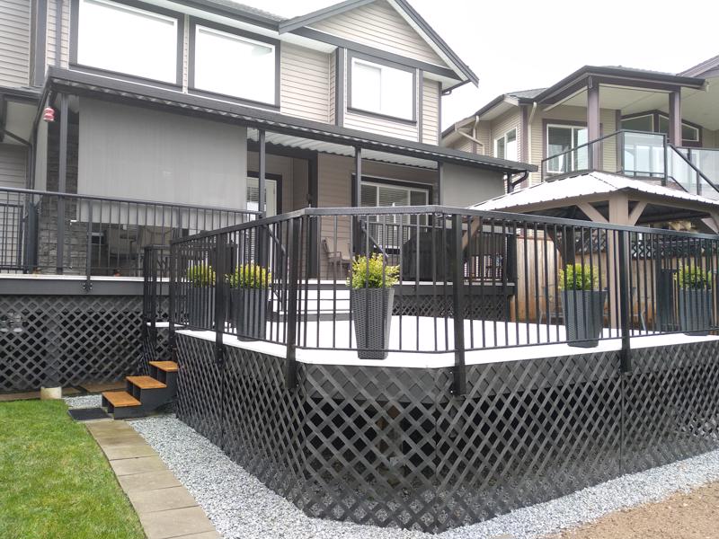 Black aluminum railings on curved deck.