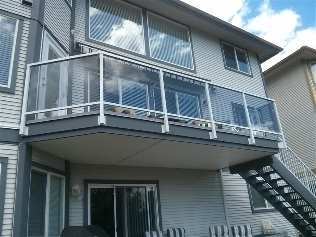 Glass railings with white trim.